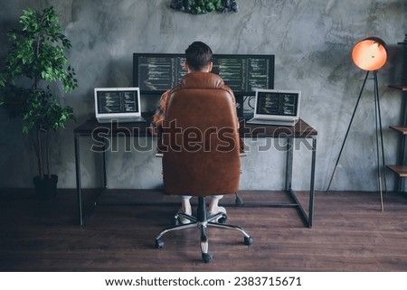 Full body rear behind portrait of skilled cyber security expert sit chair us pc laptop displays modern office indoors Royalty-Free Stock Photo #2383715671