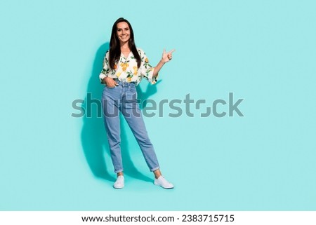 Full size photo of good mood woman dressed flower print blouse indiacting at sale empty space isolated on turquoise color background
