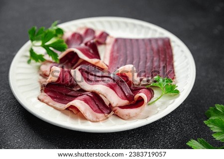 duck meat dried breast magret smoked jerky cured dried fresh eating appetizer meal food snack on the table copy space food background rustic top view
