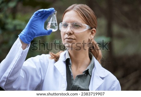 Water, research and woman scientist test in a forest for inspection of the ecosystem, sample or environment study. Science, sustainable and professional environmentalist doing carbon footprint exam