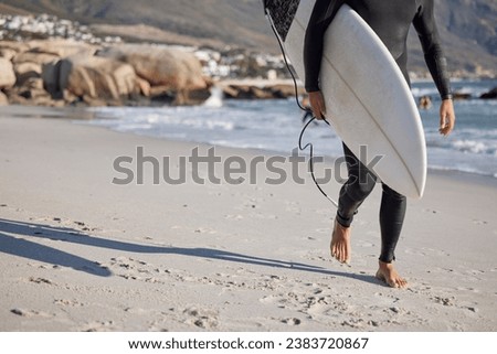 Surfing, man and walking on sand, sea and ocean for summer vacation, freedom or wellness. Legs of surfer guy, board and walk on beach of relaxing holiday, travel adventure or water sports in sunshine Royalty-Free Stock Photo #2383720867