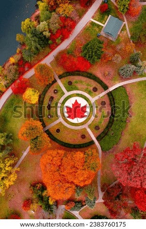 Aerial Canada Toronto in High Park. Maple leaf in Canadian flag decorated with flowers in a park.