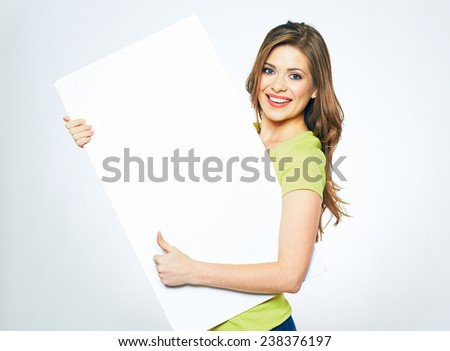 smiling woman holding white  sign board. portrait of smiling young model with long hair. isolated girl portrait.