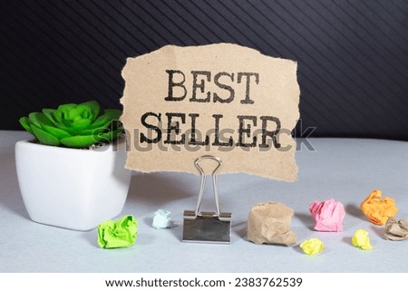 Business concept.Text BEST SELLER on a paper clipboard with,pencil,glasses, keyboard and calculator on white background.