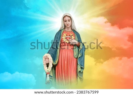Statue of Our lady of grace virgin Mary with beautiful Sky Pastel with abstract colored background and wallpaper in sweet color. at Thailand. Royalty-Free Stock Photo #2383767599