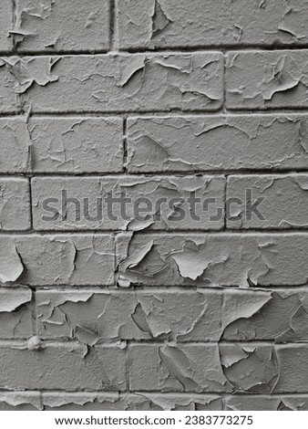 Close-up of a gray brick wall with unique textures, ideal for creating grain effects in detailed photo editing