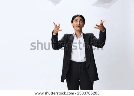 Business woman throwing papers documents in black business suit showing signals gestures and emotions on white background, freelancer job online time management