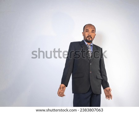 businessman using office suite confidently posed in front of camera