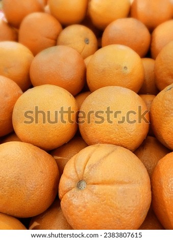 Box of full ripe oranges looks fresh on Asian market