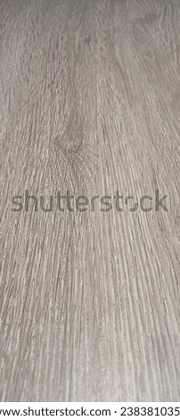 Picture of grey wood panel with its repetitive vertical pattern of wood vein