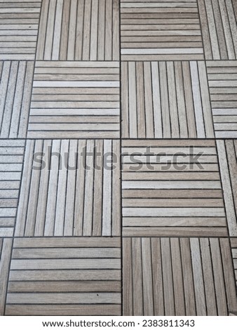 Picture taken from above of floor made of wood with combination of vertical and horizontal placement