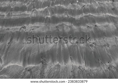 Horizontal wave pattern on grey sandy beach with pebbles, Nuchatlitz Provincial Park, Nootka Island, British Columbia