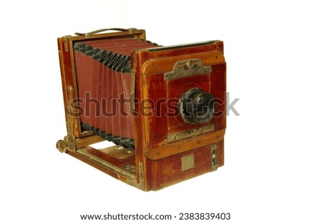 Large format wooden folding camera for shooting on photographic plates. Isolated on white.