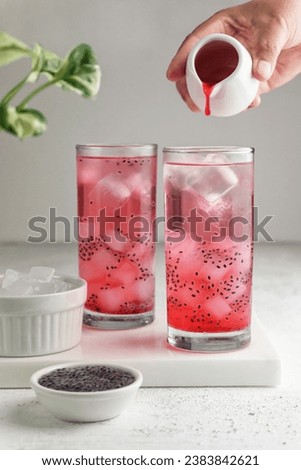 Iced Cocopandan syrup served with topping nata de coco and basil seeds.
High key for food photography. Selective focus. Blurry foreground and bacground. Royalty-Free Stock Photo #2383842621