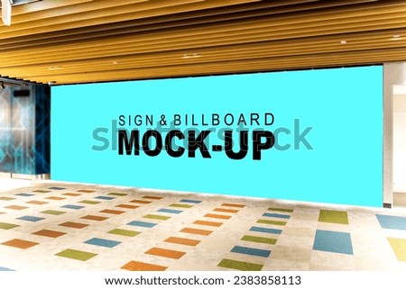 Blank white vertical mockup signboard in a shopping mall entrance. Perfect for advertising or marketing