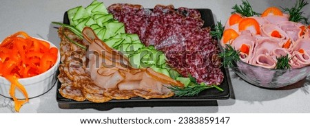 Sliced Processed Salami meats decorated with vegetables