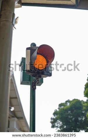 Red traffic light with a blurry background