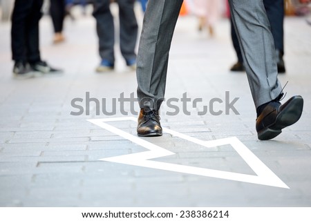 Business man in suit taking a big fast step forward, arrow Royalty-Free Stock Photo #238386214