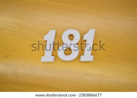 The golden yellow painted wood panel for the background, number 181, is made from white painted wood.