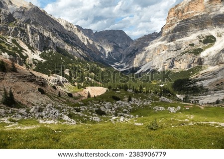Valley Val Travenanzes and path way rock face in Tofane gruppe, Alps Dolomites mountains, Fanes national park, Italy Royalty-Free Stock Photo #2383906779