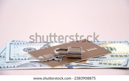 Financial fraud protection concept: credit card, padlock and master key on the light background.