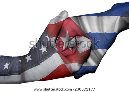 Diplomatic handshake between countries: flags of United States and Cuba overprinted the two hands Royalty-Free Stock Photo #238391197