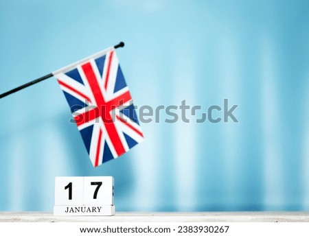 January calendar with British flag with number  17.  Calendar cubes with numbers. Space copy.