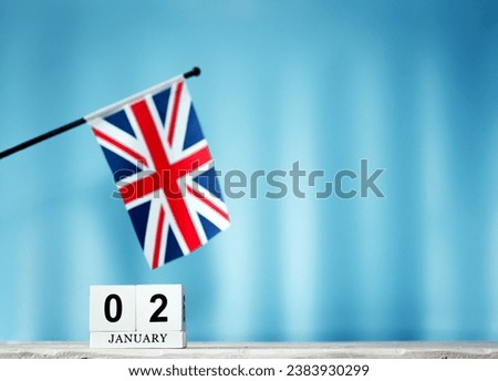 January calendar with British flag with number 2. Calendar cubes with numbers. Space copy.