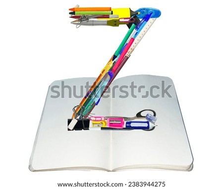 Z shape made of various kinds of stationery isolated on white background, suitable for template design.