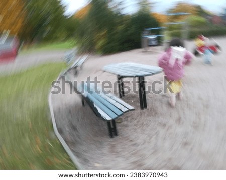 whirling sand playground, bench and table and kid