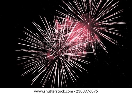Luxury fireworks event sky show with red big bang stars. Premium entertainment magic star firework at e.g. New Years Eve or Independence Day party celebration. Black background copyspace
