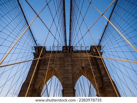 A stunning stock photo of the iconic Brooklyn Bridge, one of New York City's most popular tourist destinations. 