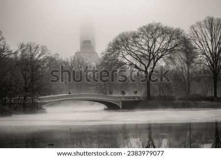 A high-quality stock photo of the charming Bow Bridge, one of Central Park's most iconic landmarks. 