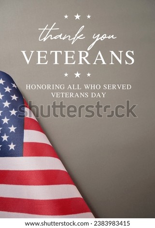 Vertical greeting card Veterans Day on November 11.  Honoring All Who Served. American flags against a gray background.