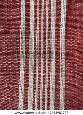 White stripes on red cloth, background, stock photo