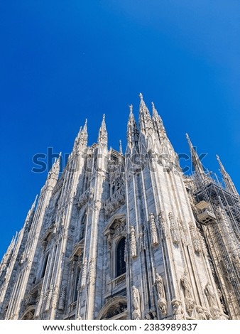 picture of a church in Italy. it is surrounded by a blue sky and the weather there is a little hot causing the picture to be slightly overexposed