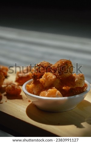 Snack on dry dumplings or  siomay cikruh. Made from dumpling skin and tapioca flour which are fried and seasoned.