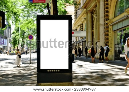 billboard on busy street. blank white poster and advertiser ad space. digital outdoor display lightbox. base for mockup. empty display panel. glass design. soft streetscape. urban background