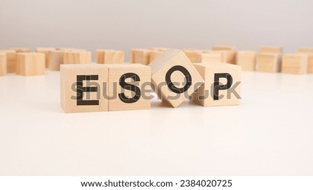 selective focus. word ESOP is written on a wooden cubes structure. blocks on a bright background