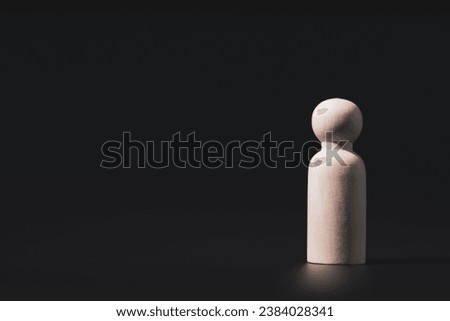 Wooden stock block and copy space, black background, hr hrm concept, business leader