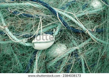 Ropes and net on fishing boat in harbour. Maritime background. graphic