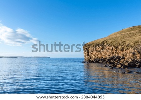 Scenic cliffs near Dunnet Head, in Caithness, on the north coast of Scotland, the most northerly point of the mainland of Great Britain Royalty-Free Stock Photo #2384044855