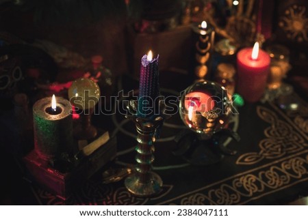 Candle lights in dark room. Concept of divination, oracle and predictions, rituals and other magic 