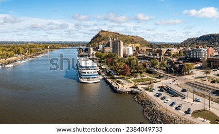 Panoramic aerial view of the town of Red Wing in Minnesota with river cruise boat docked Royalty-Free Stock Photo #2384049733