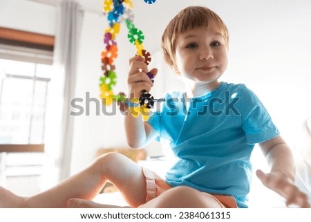 Photo of a Curious Child Contemplating the World from His Bedroom in parents bedroom