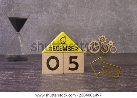Cube shape calendar for February 05 on wooden surface with empty space for text, new year Wooden calendar with date, January cube calendar on wooden surface with copy space. Royalty-Free Stock Photo #2384081497