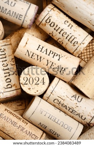 Happy New Year 2024 greeting card with wine corks. No visible trademarks