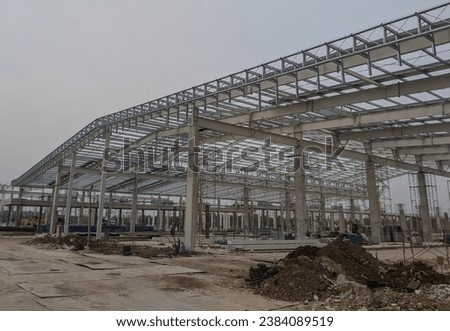 installation of steel roof trusses on new factory construction, steel frames on factory warehouses