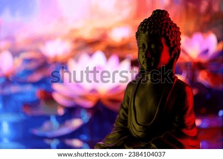 Buddha Purnima and Vesak day concept, Buddha statue with low key light against beautiful and colorful background close up. Meditation Royalty-Free Stock Photo #2384104037
