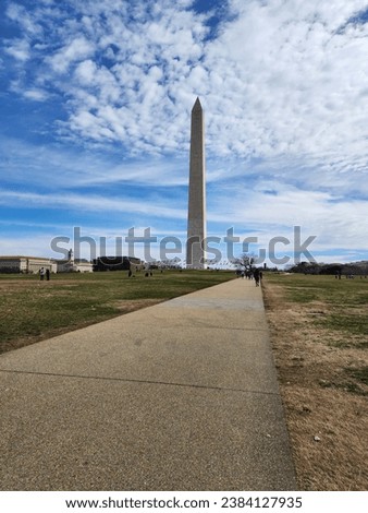Washington monument far away with blue sky in background
